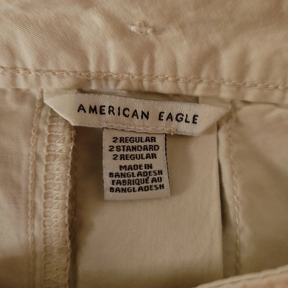American Eagle Pleated Cream High-Waisted Mini Skirt - Picture 5 of 11